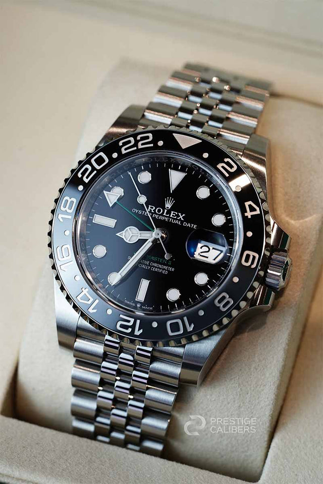 126710grnr aka Bruce Wayne Rolex watch with black dial inside a rolex box