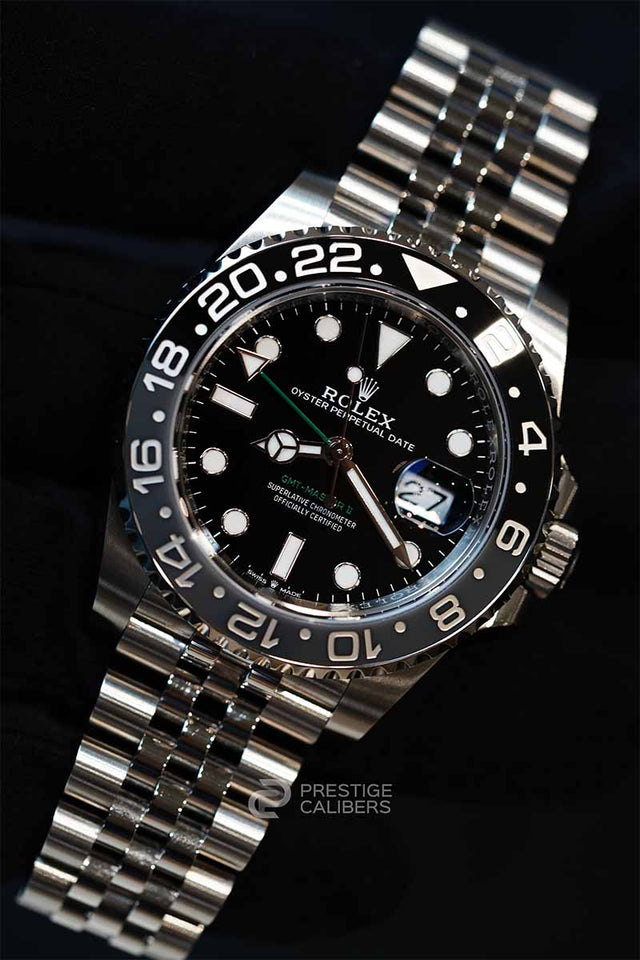 Rolex Bruce Wayne watch with black dial on a dark background