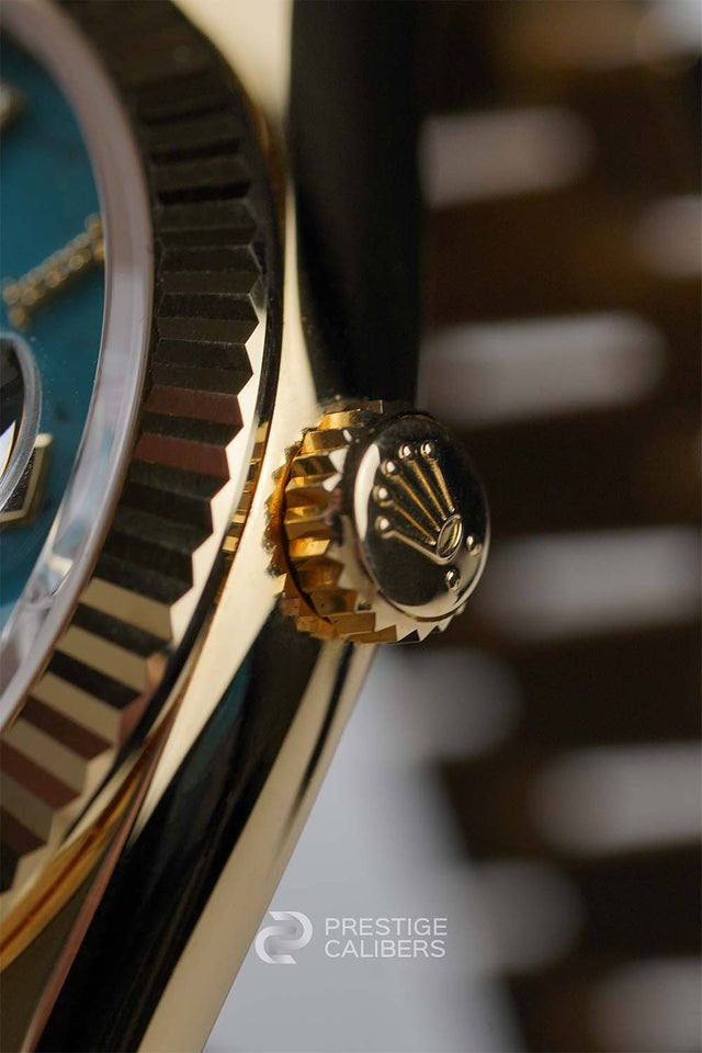 Close-up of a winding crown of a Rolex Oyster Perpetual Day-Date 36mm Turquoise Woman's watch 128238-0071