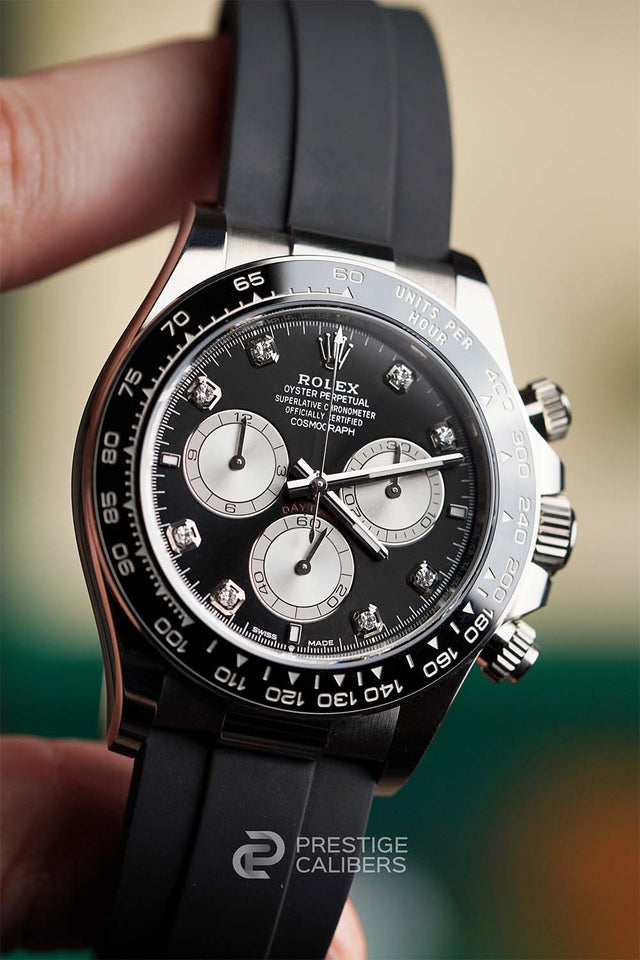 Luxury watch Rolex Cosmograph Daytona 126519LN-0004 with black dial and diamonds indexes and silver accents, held by a hand, branded