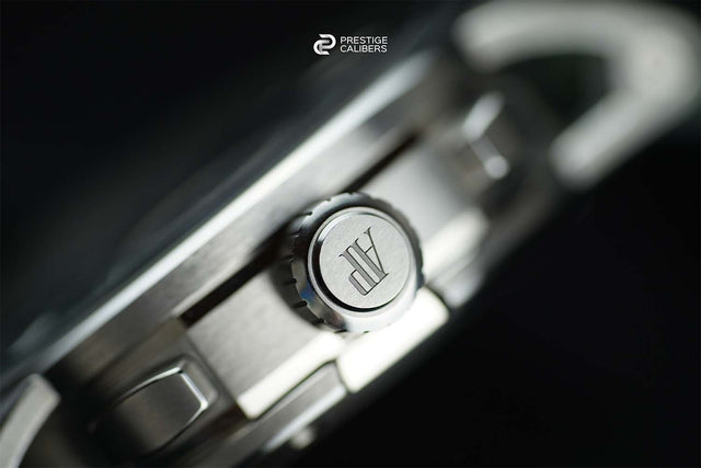 Close-up of an Audemars Piguet watch with a brand logo on a dark background