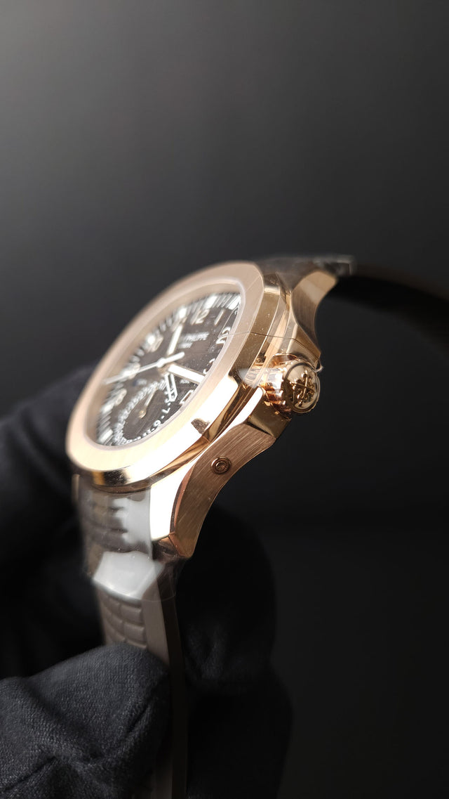 Patek Philippe Aquanaut Travel Time 5164R-001 40.8 mm rose-gold men’s watch with brown dial on brown rubber strap with folding clasp
