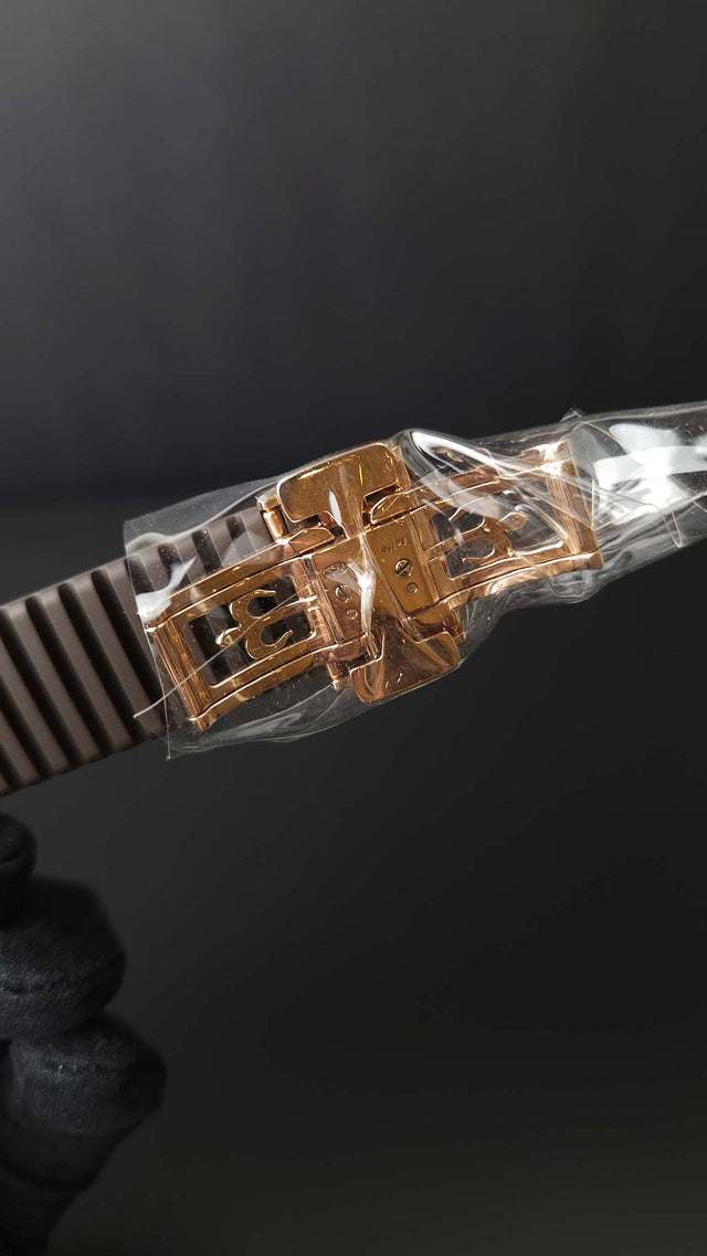 Patek Philippe Aquanaut Travel Time 5164R-001 40.8 mm rose-gold men’s watch with brown dial on brown rubber strap with folding clasp
