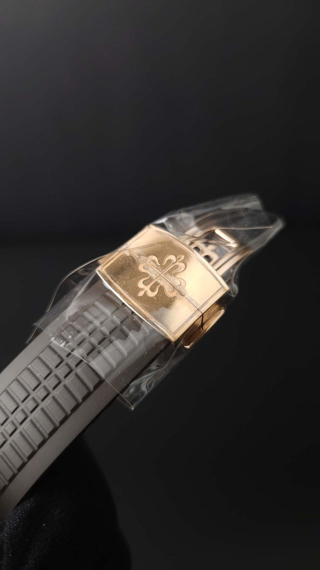 Patek Philippe Aquanaut Travel Time 5164R-001 40.8 mm rose-gold men’s watch with brown dial on brown rubber strap with folding clasp
