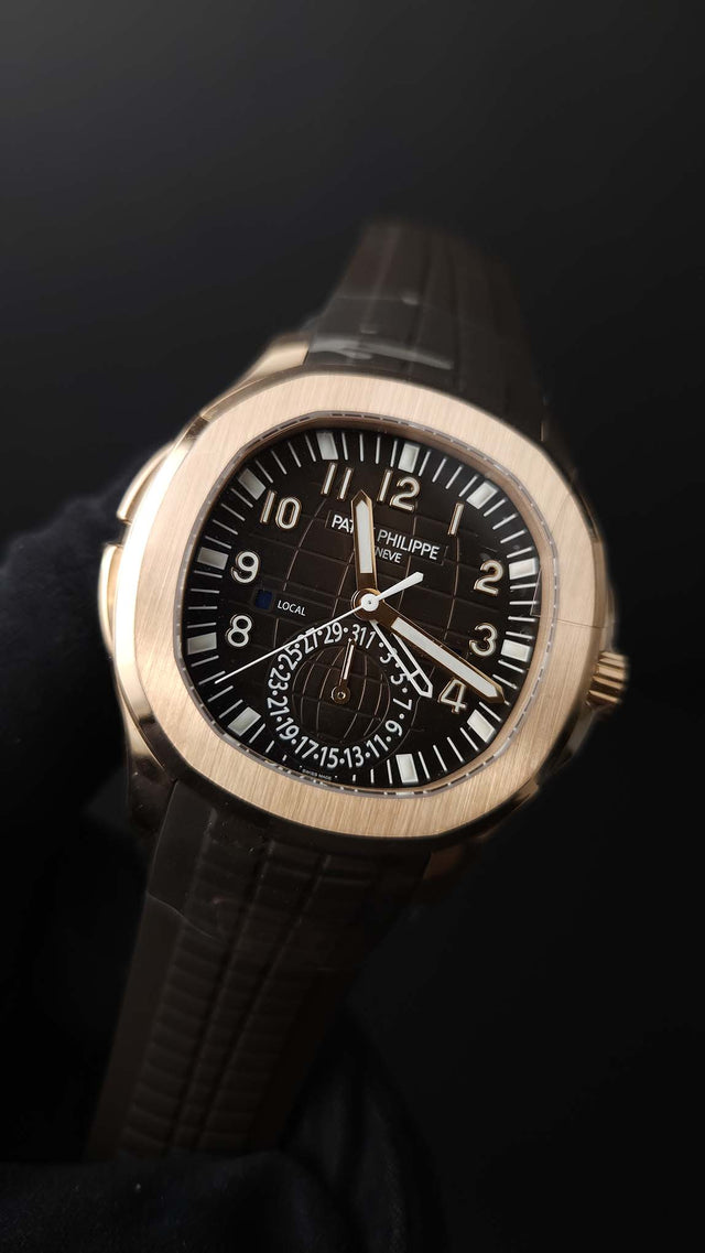 Patek Philippe Aquanaut Travel Time 5164R-001 40.8 mm rose-gold men’s watch with brown dial on brown rubber strap with folding clasp
