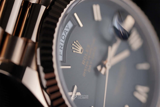 Close-up of a Rolex watch 228235-0055 with a detailed view of the dial and brand logo.