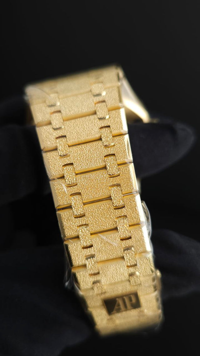 Audemars Piguet Royal Oak Frosted Gold Double Balance Wheel Openworked 15412BA.YG.1224BA.01 41 mm yellow gold men’s watch with rainbow gemstone bezel and openworked slate grey dial