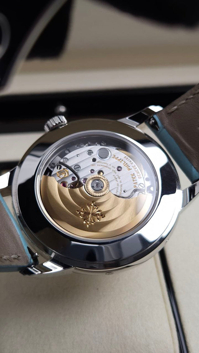 Patek Philippe Calatrava Weekly Calendar 5212A-001 40 mm stainless-steel men’s watch with silver dial on blue alligator strap with folding clasp
